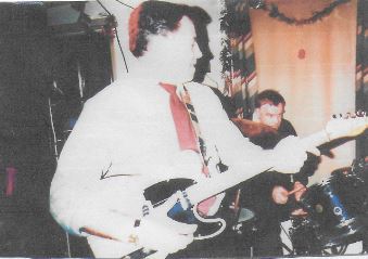 The Power brothers, Bill, front, and John, perform at Christmas 1985