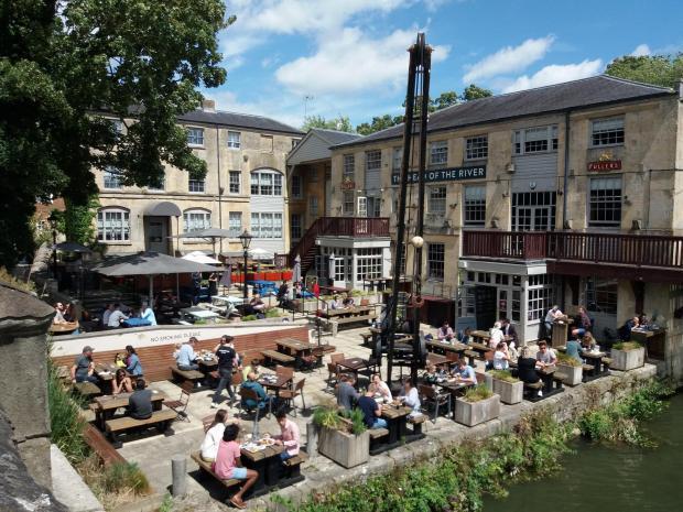 Drinkers outside the Head of the River on Super Saturday in July